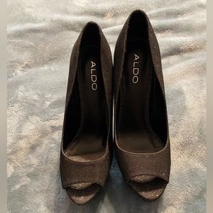 Also platform heels in black shimmer color